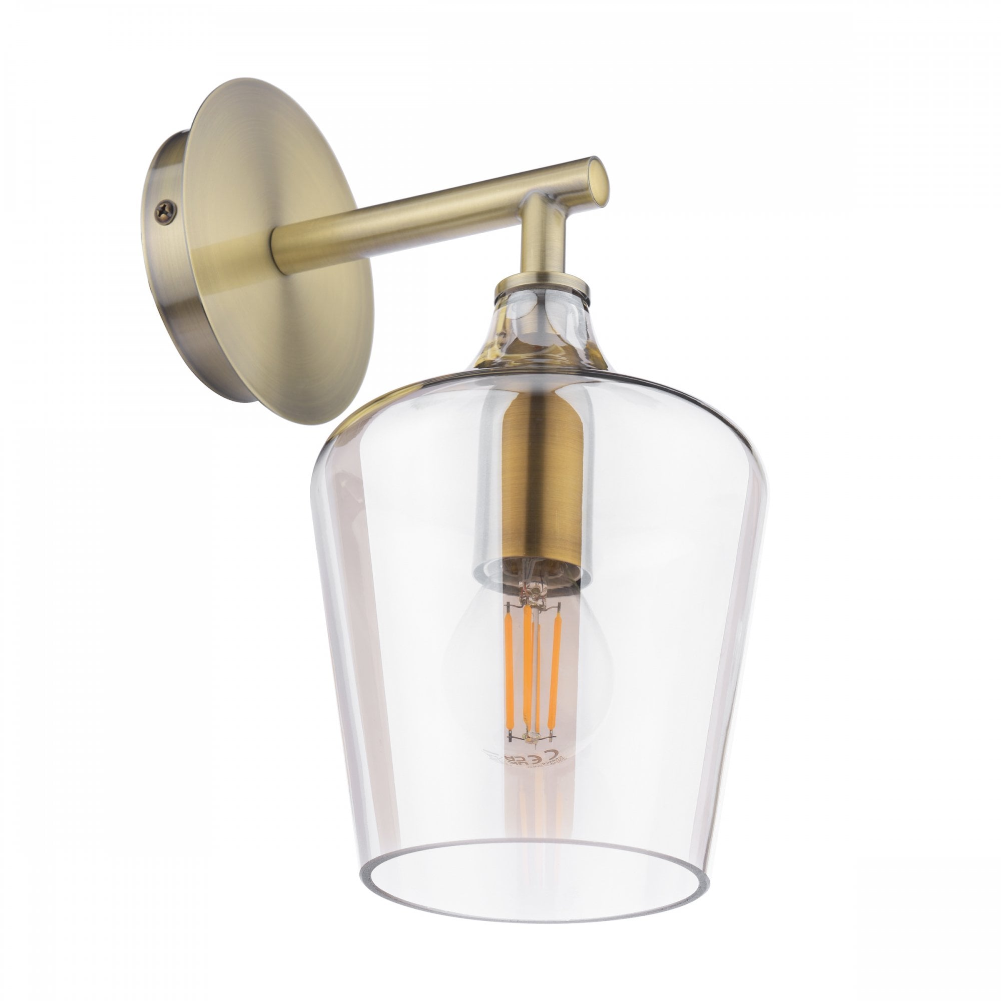 A brass wall light with a clear glass shade and a visible LED filament bulb.