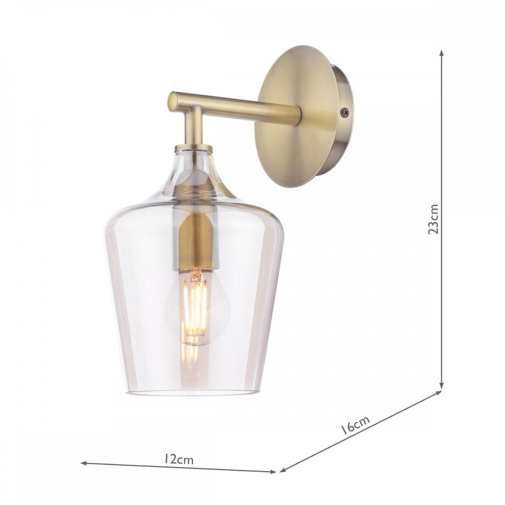 A brass wall light with a clear glass shade, showing dimensions of 23cm, 16cm, and 12cm.
