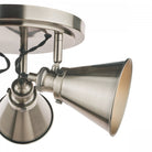 A close-up of a single bulb on an industrial-style ceiling light.