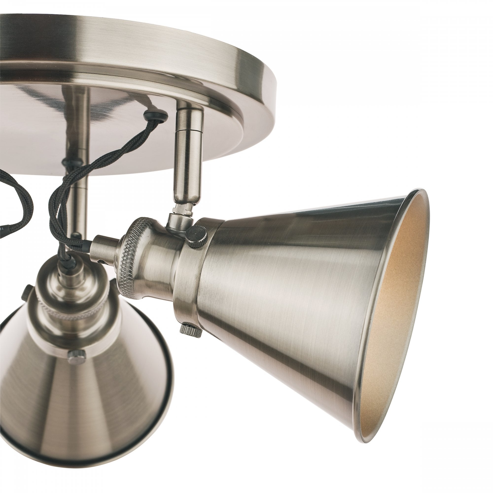 A close-up of a single bulb on an industrial-style ceiling light.