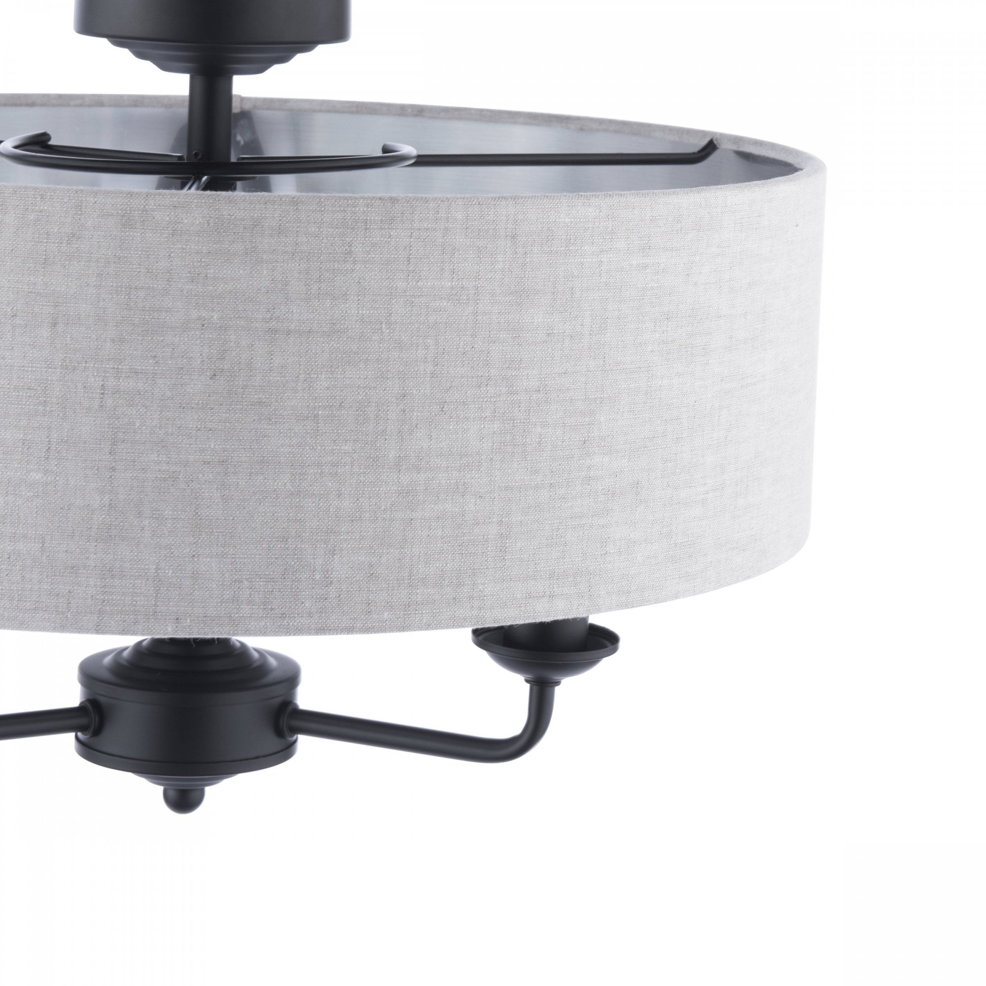 Close-up of a semi-flush mount ceiling light with a grey fabric drum shade and black fixtures.