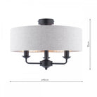 A semi-flush mount ceiling light with a grey fabric drum shade and three exposed black bulbs with measurements.
