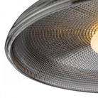 A detailed close-up of the textured gray glass of the minimalist ceiling light.