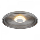 The minimalist ceiling light features a textured gray glass shade and a warm, central light.