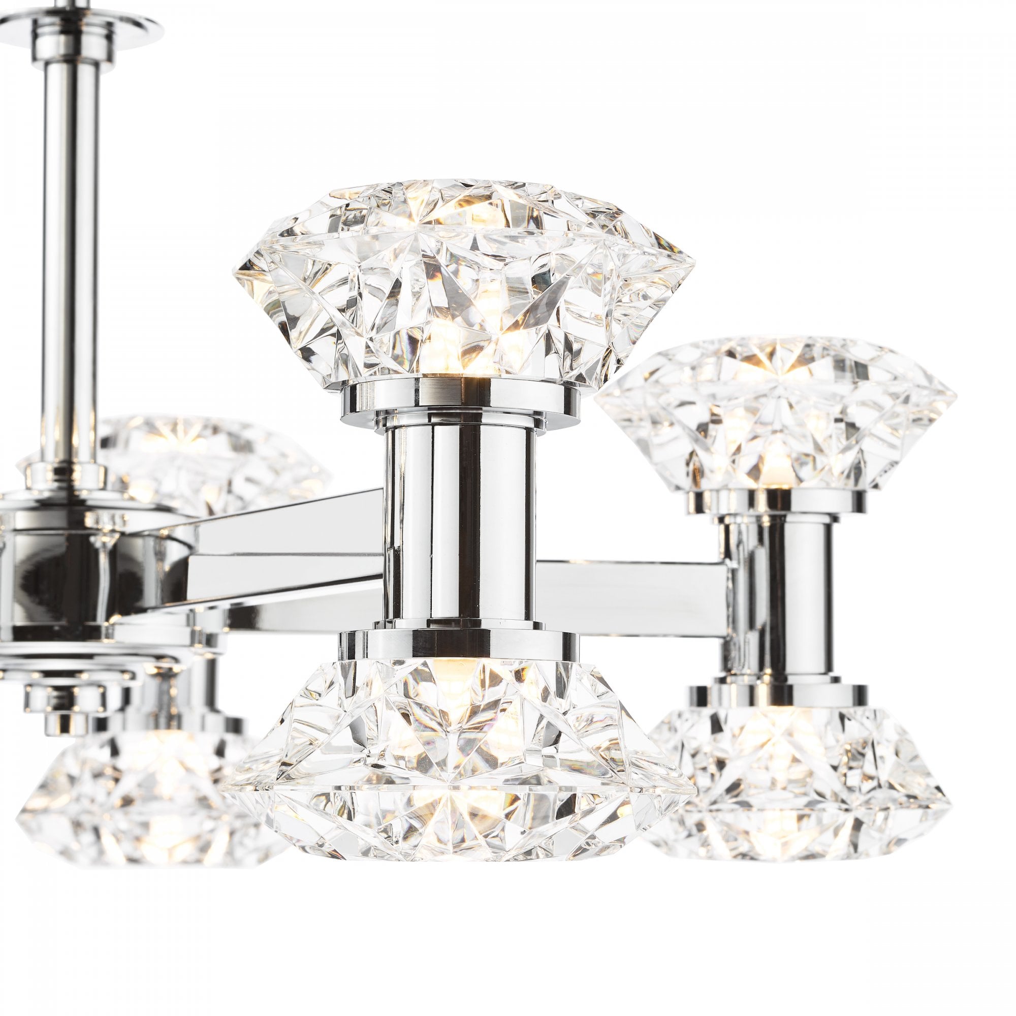 Close-up of a modern chrome chandelier's crystal shades, highlighting their brilliant facets.