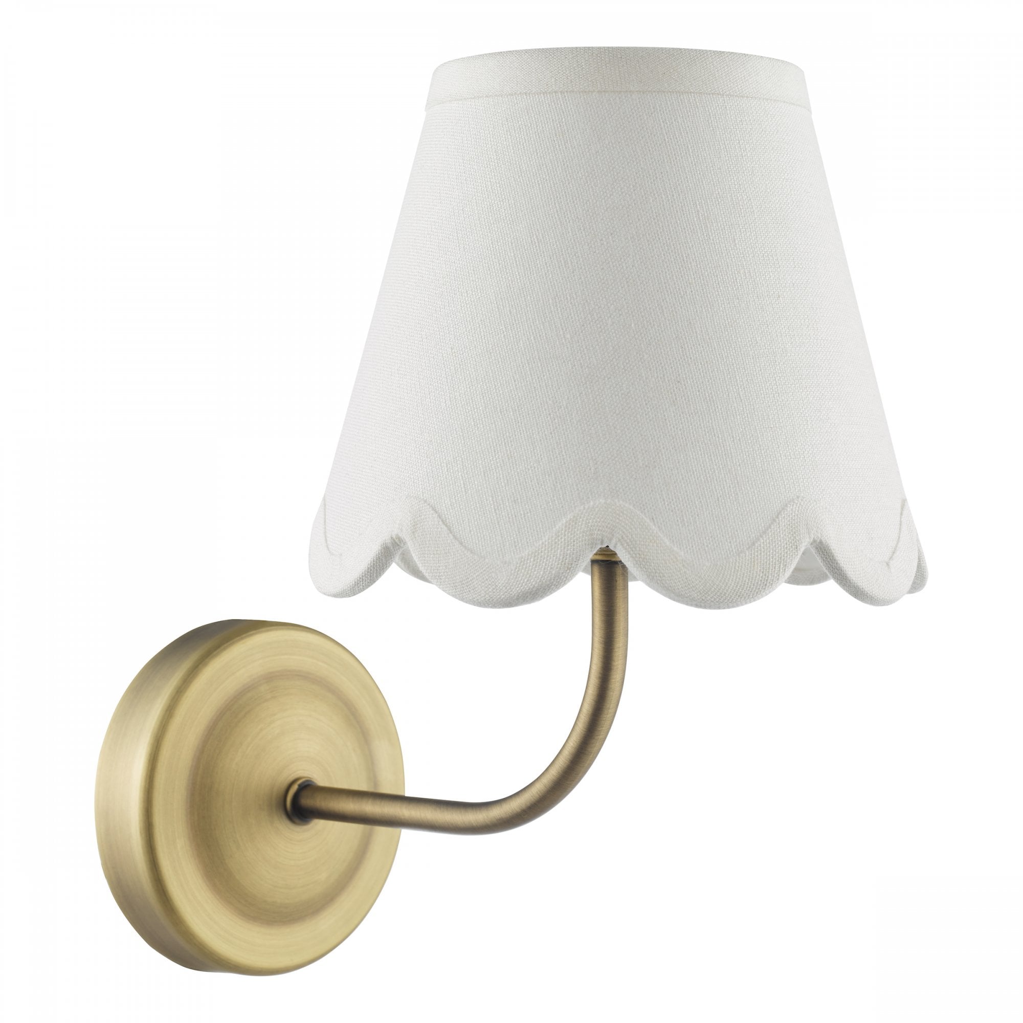 Brass wall sconce with a white scalloped fabric shade, isolated on white.
