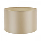 A sleek, cylindrical lampshade in a soft, muted cream color with a light interior.
