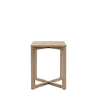 Front view of a light wooden square side table with a unique cross-shaped base.