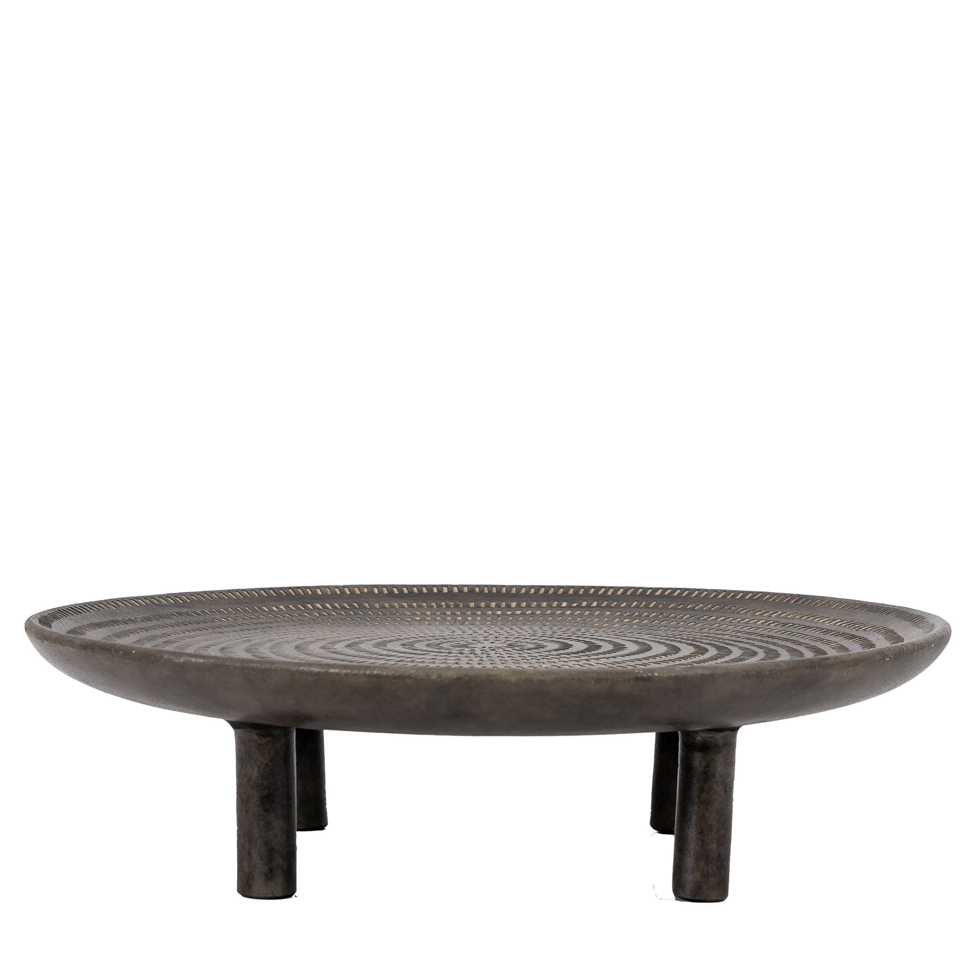 Round, dark-toned decorative tray with intricate carved patterns and four sturdy legs.