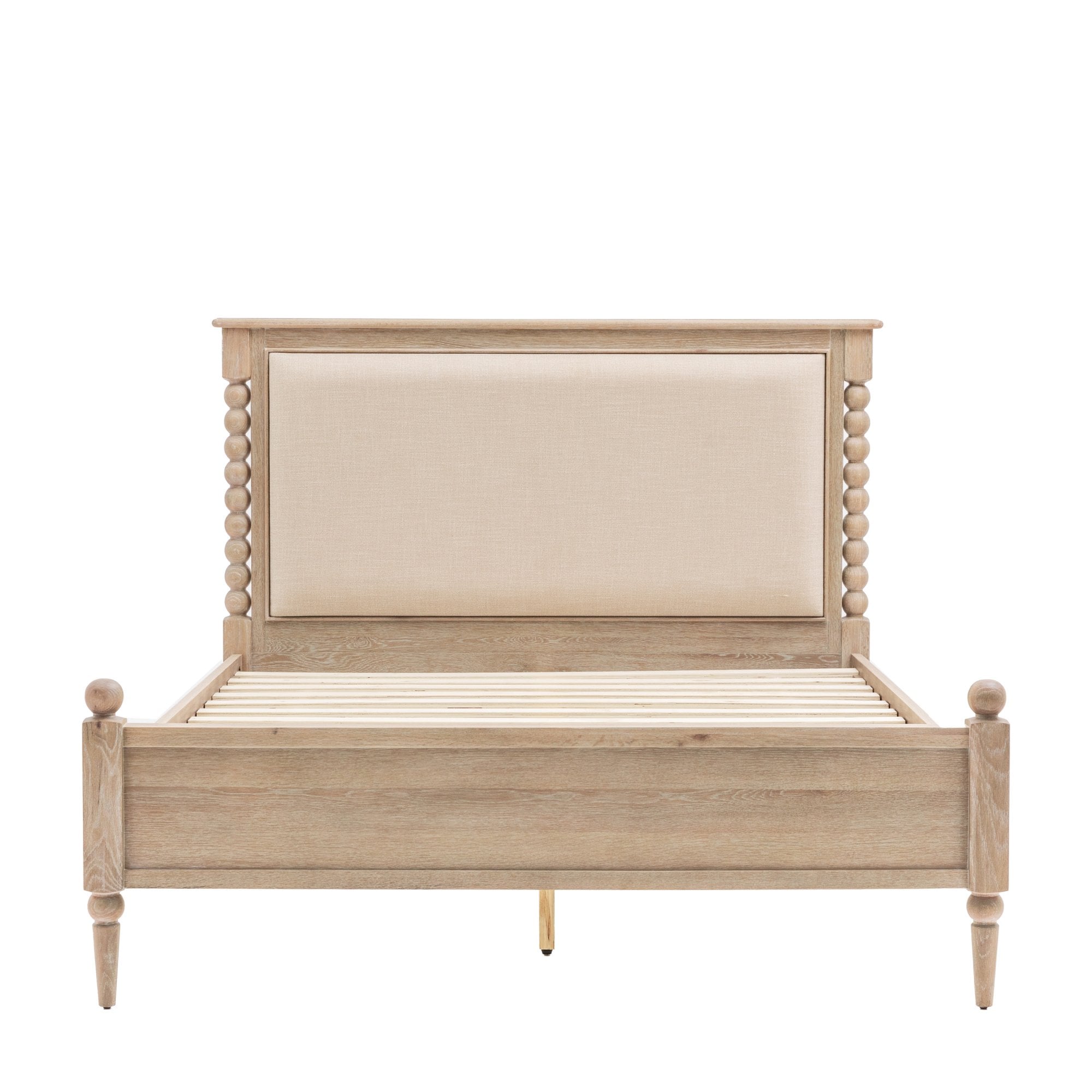 A light wood bed frame with an upholstered, rectangular headboard and carved details.