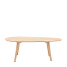 A light wooden coffee table with a unique, rounded, elongated top and four tapered legs.