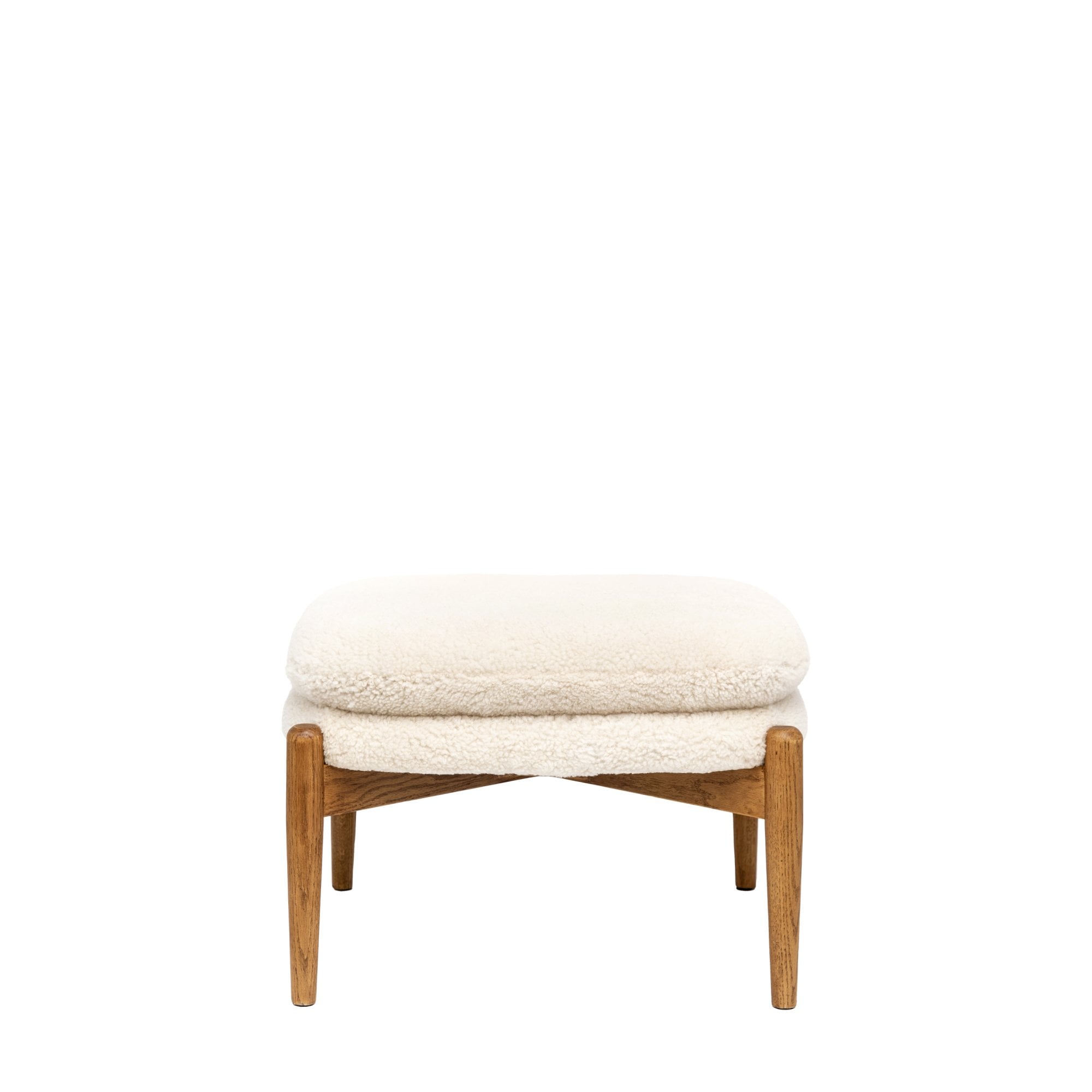A white sheepskin footstool with a light wooden frame, isolated on a white background.