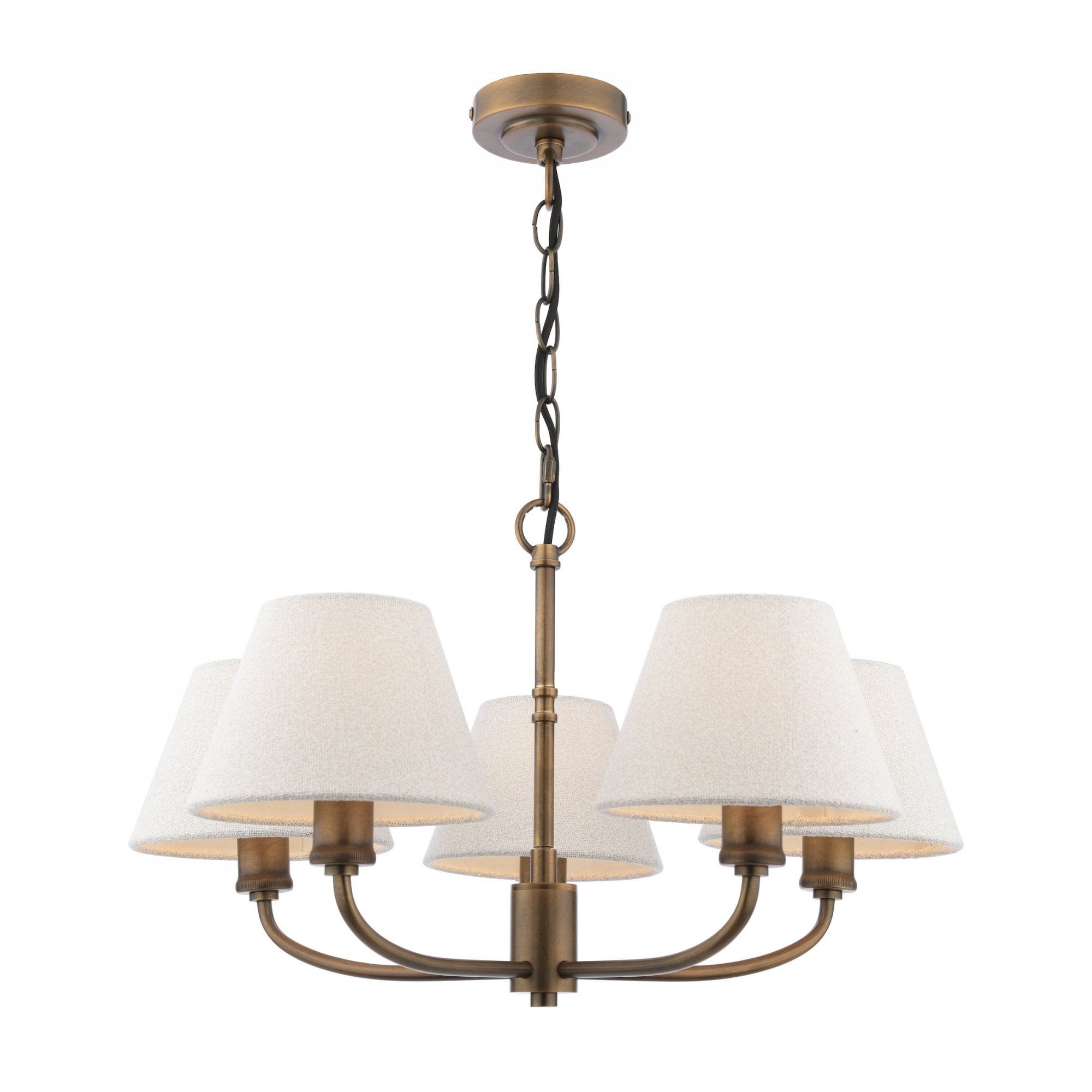 A five-light chandelier with white shades and an antique brass finish.