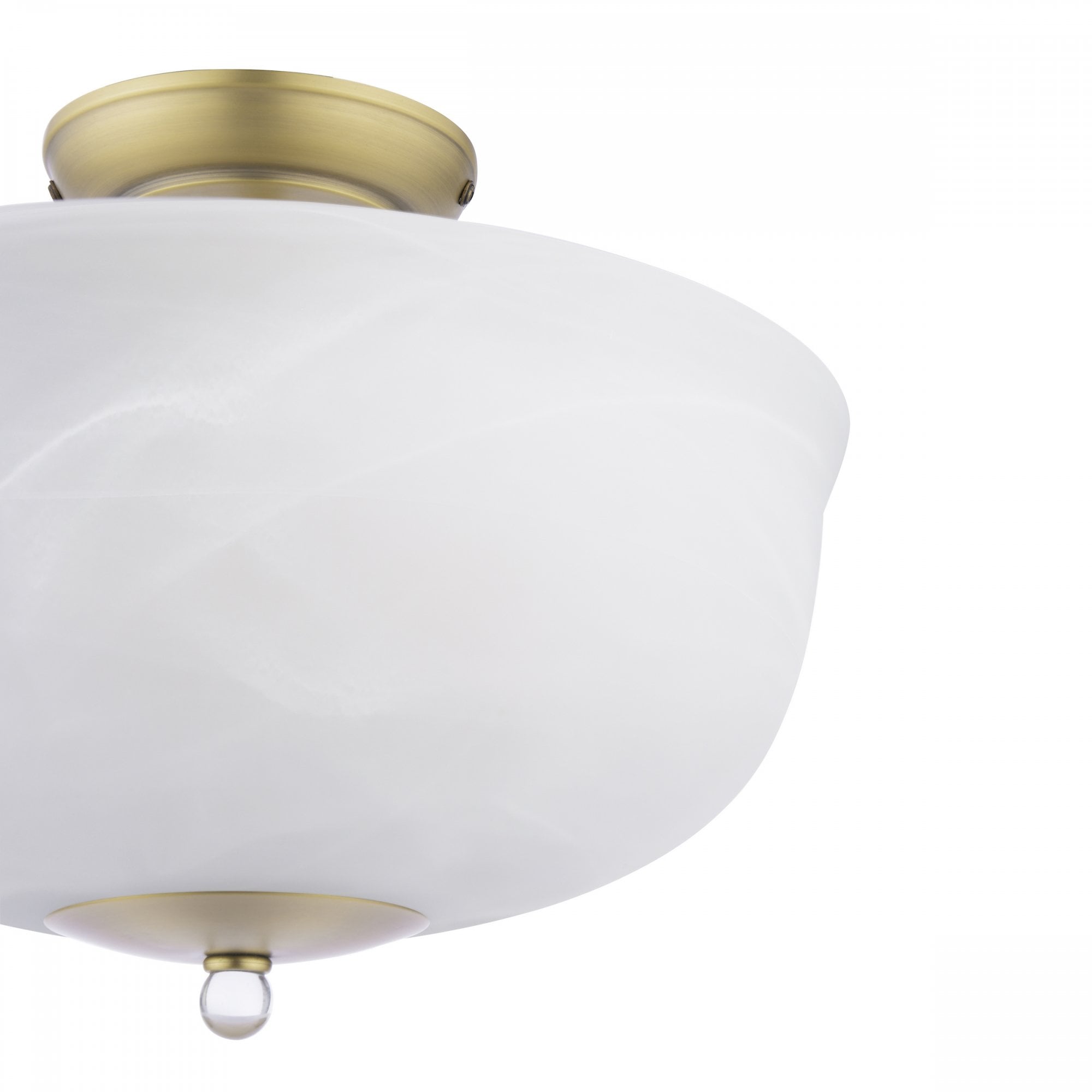 Close-up of a semi-flush ceiling light with a brass base and a white marbled glass shade.