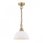 An ivory ribbed ceramic dome pendant light with a brass chain on a white background.