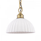 Close-up of an ivory ribbed ceramic dome pendant light with a brass fitting.