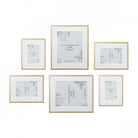 A set of six gold picture frames with white matting, arranged on a white background.