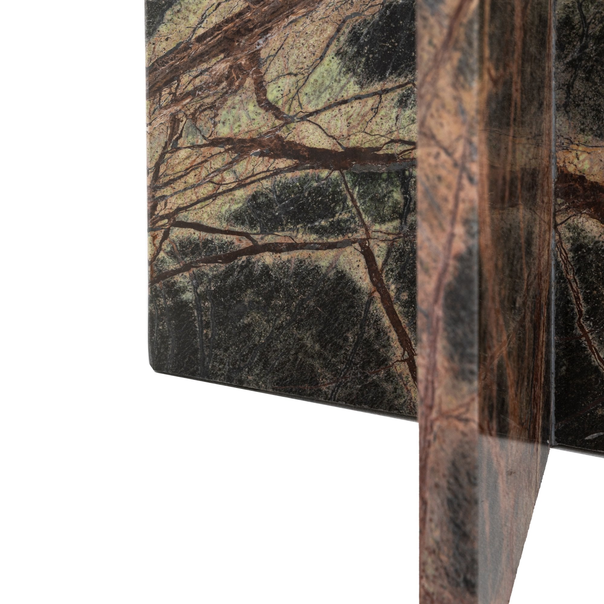 Close-up of the dark green marble table's base, highlighting its unique veining patterns.