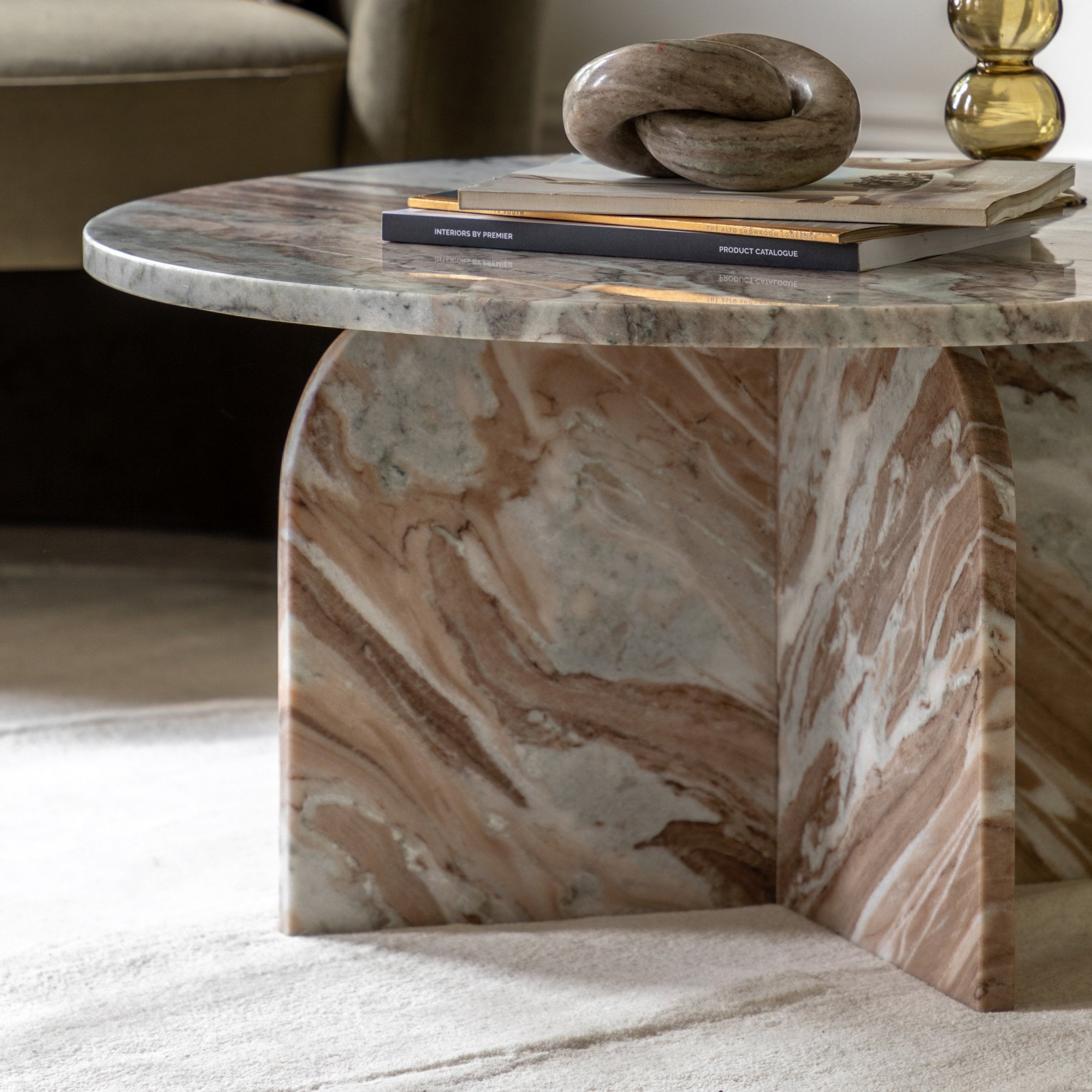 Side view of the marble coffee table, showcasing its design and details.