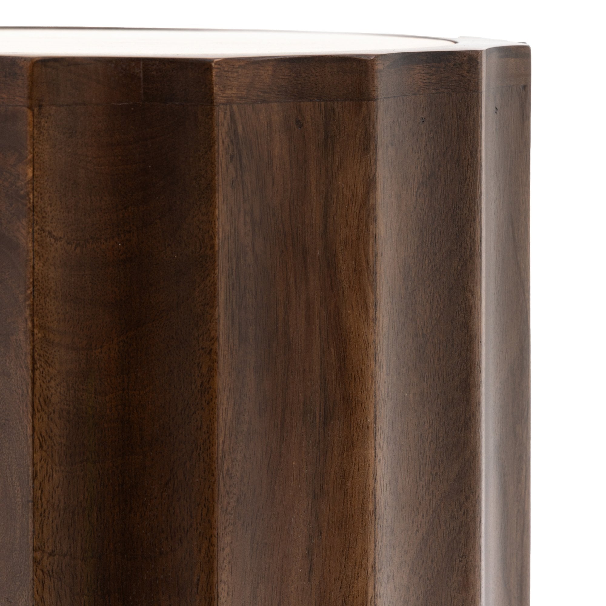 A close-up showing the vertical fluted design of the dark wood side table.