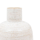 Close-up of the textured neck and shoulder of a light-colored ceramic vase.