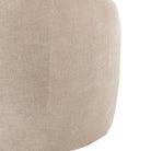 Close-up of the textured beige fabric on the side of the sofa.