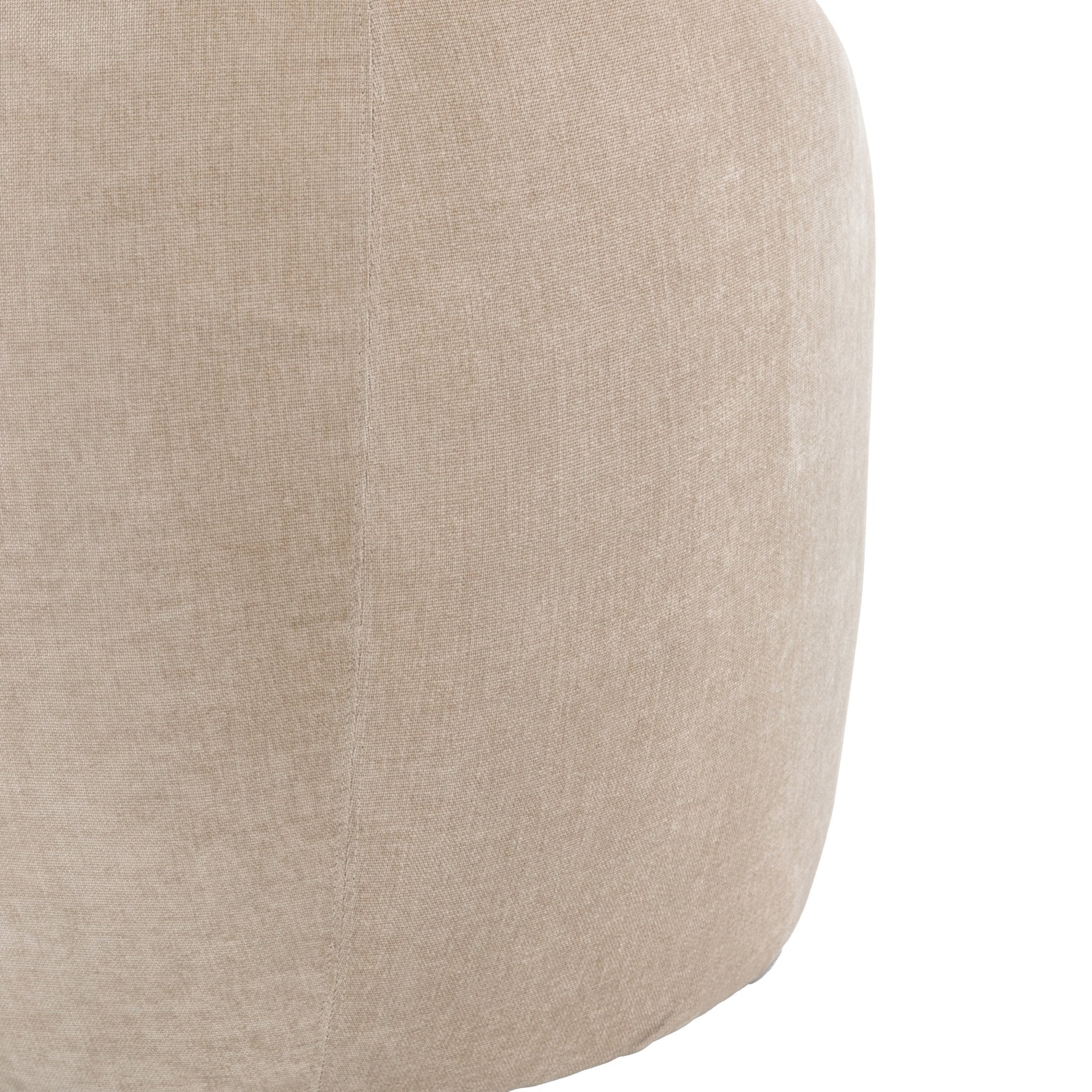 Close-up of the textured beige fabric on the side of the sofa.