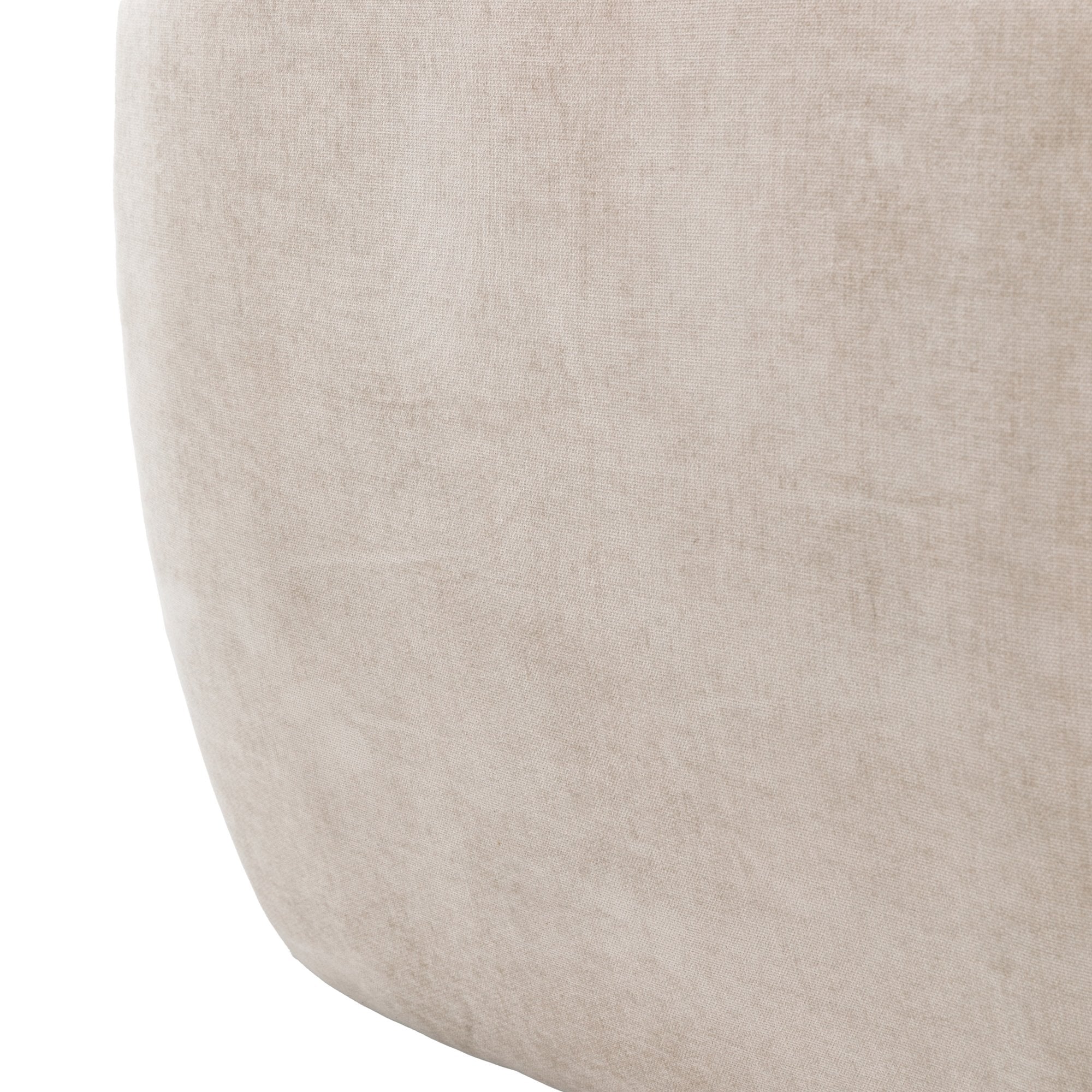Macro shot of the beige sofa's textured fabric.