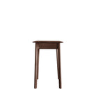 Side view of the slender wooden desk, emphasizing its compact and refined design.