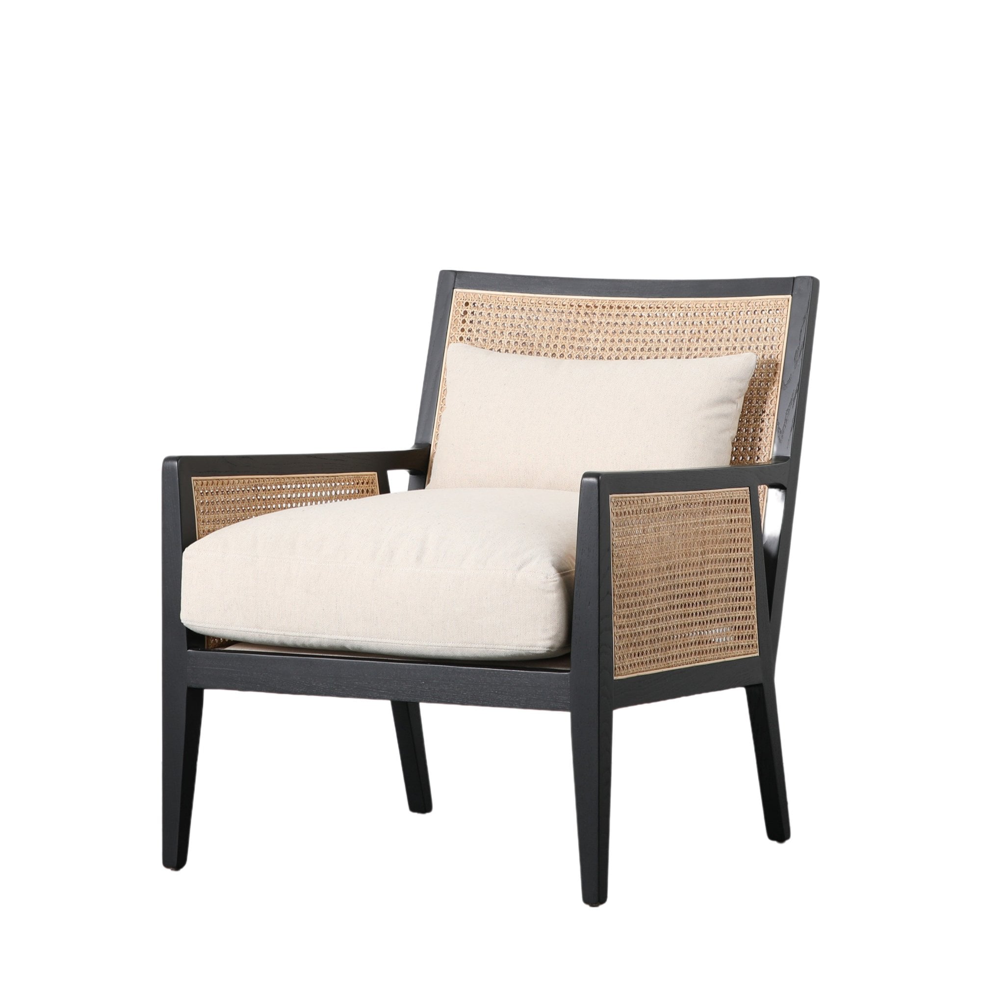 Three-quarter view of the black wooden armchair with woven cane details and soft cushions.