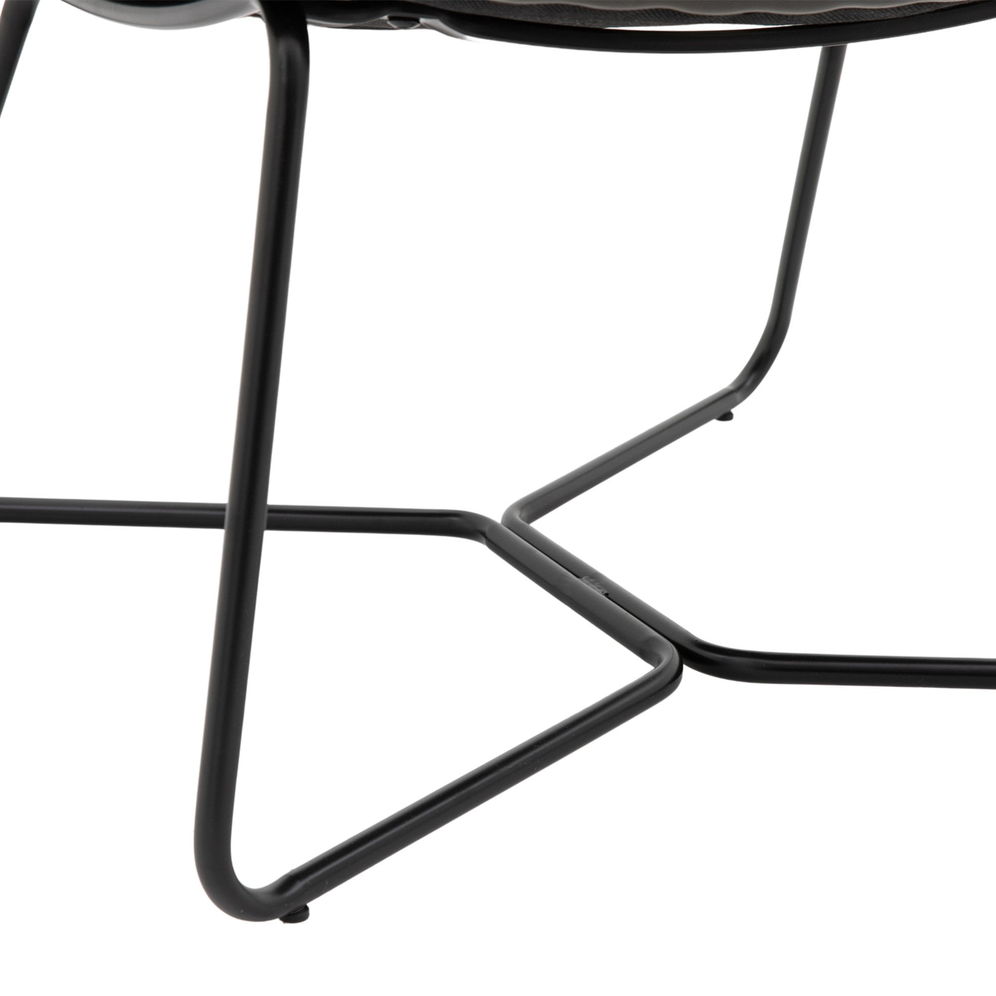 Close-up of the black metal frame and legs of the lounge chair, showing cross detail.