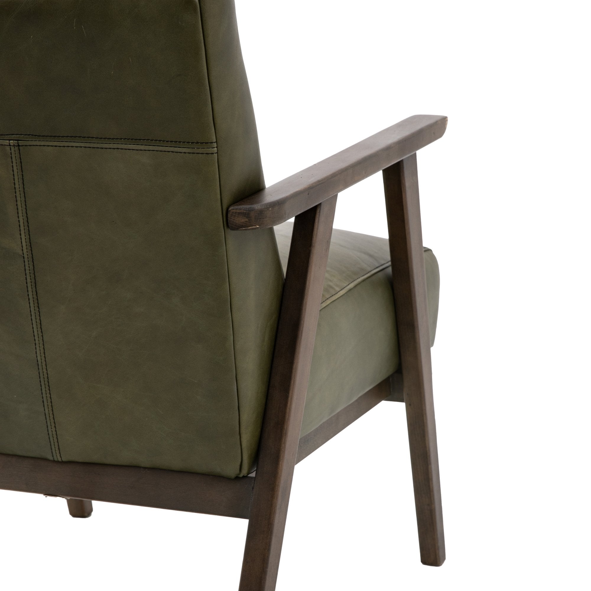 Close-up of the back and arm of a green leather armchair with wooden frame.