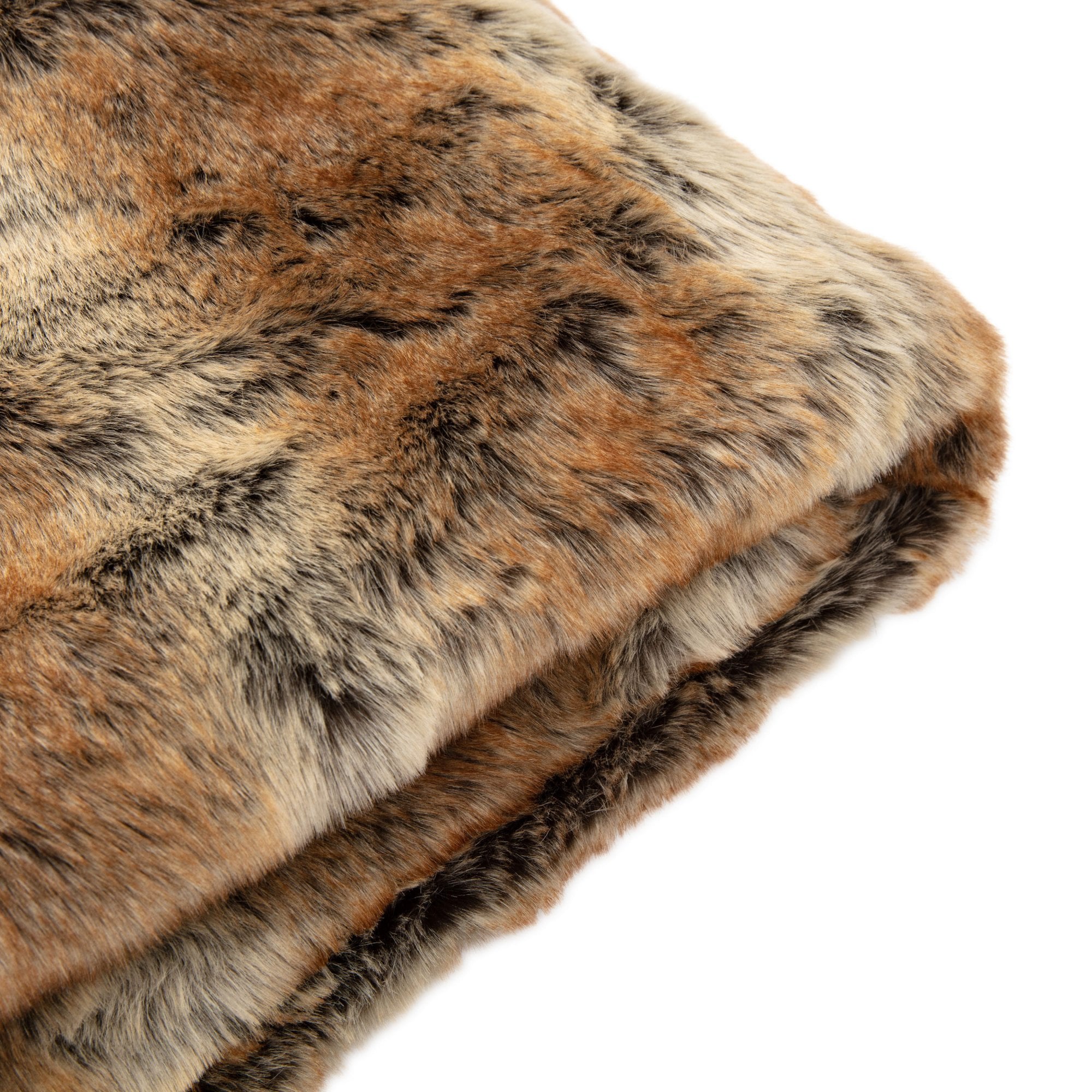 A close-up, angled view of the folded faux fur throw, highlighting its luxurious texture and color.