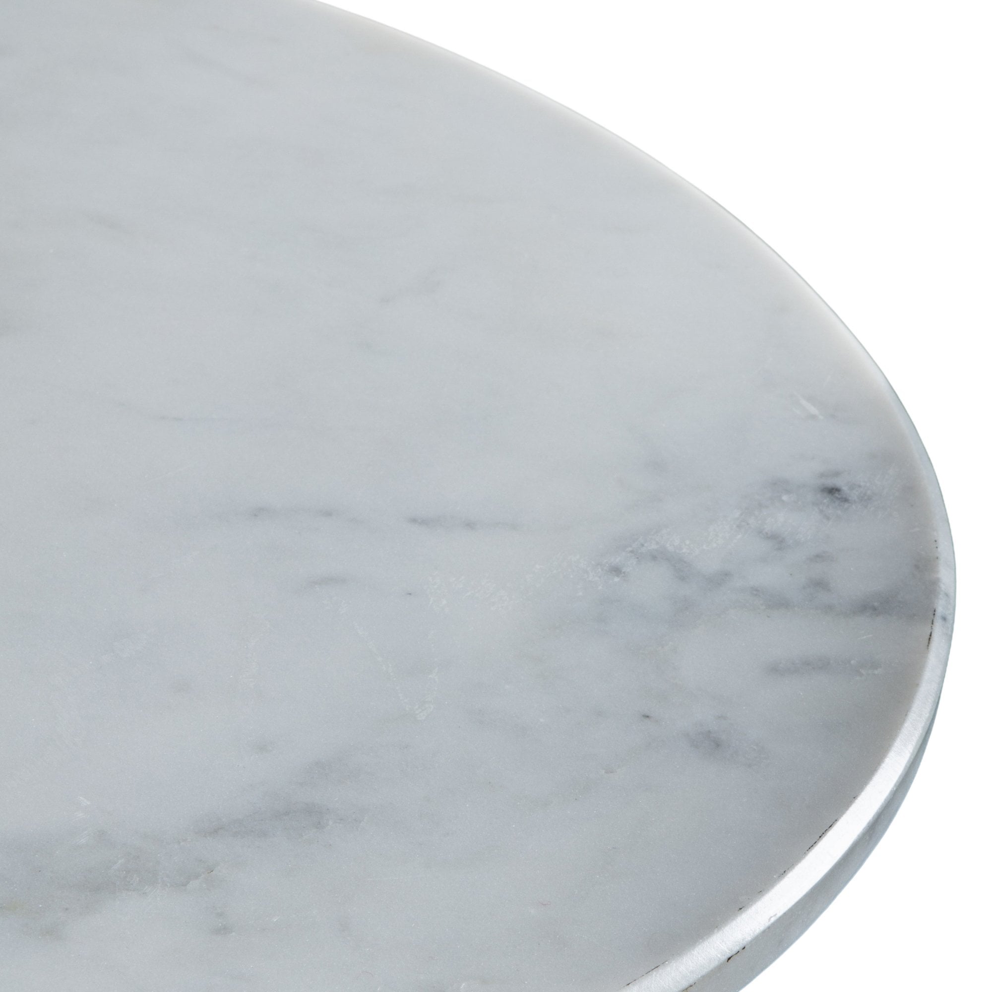 Close-up of the smooth, round white marble tabletop with gray veining.