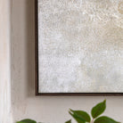 Close-up of the textured surface of an abstract painting.
