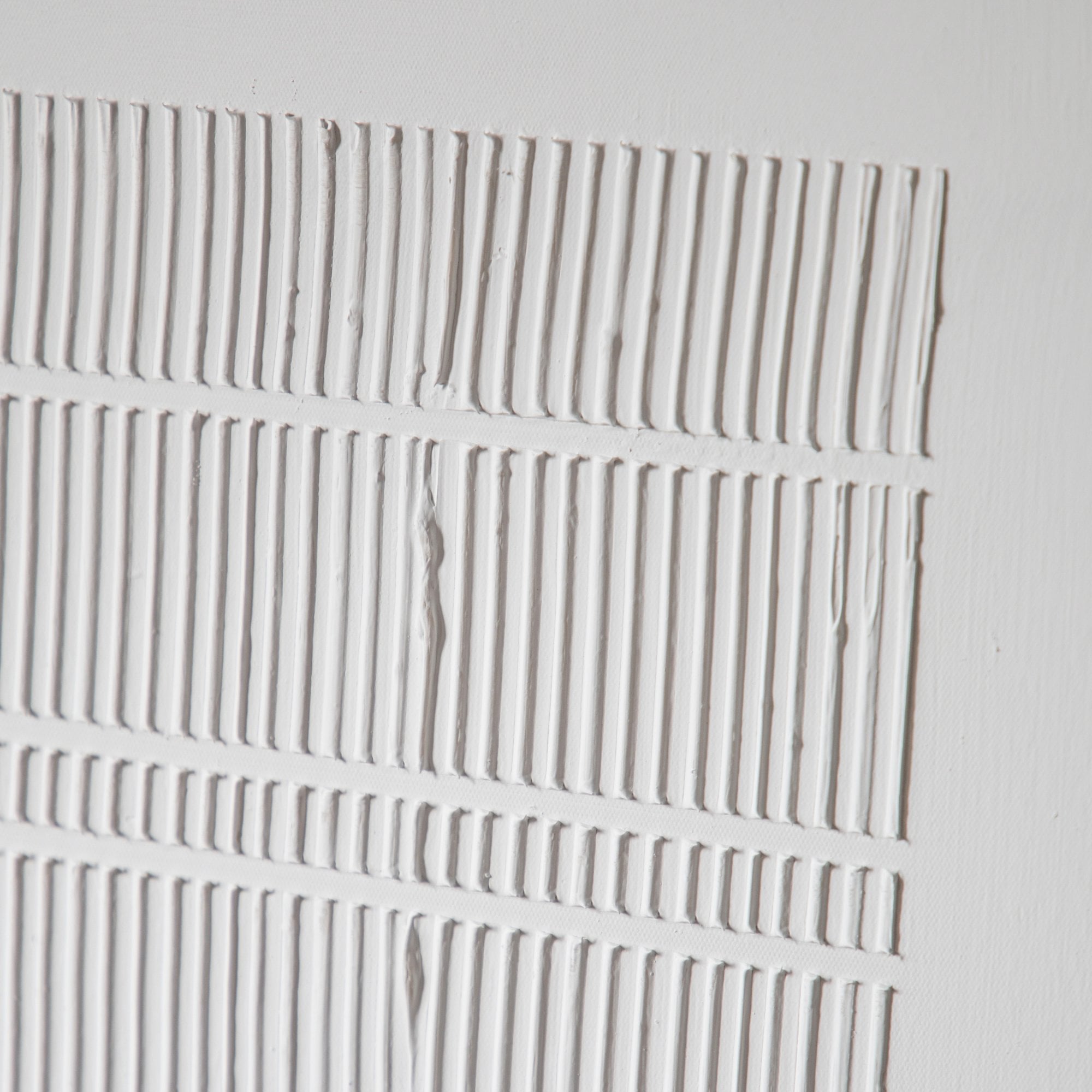 A close up of the grooves on the framed wall decor.
