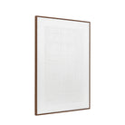A framed piece of white and textured wall decor, angled to the right.