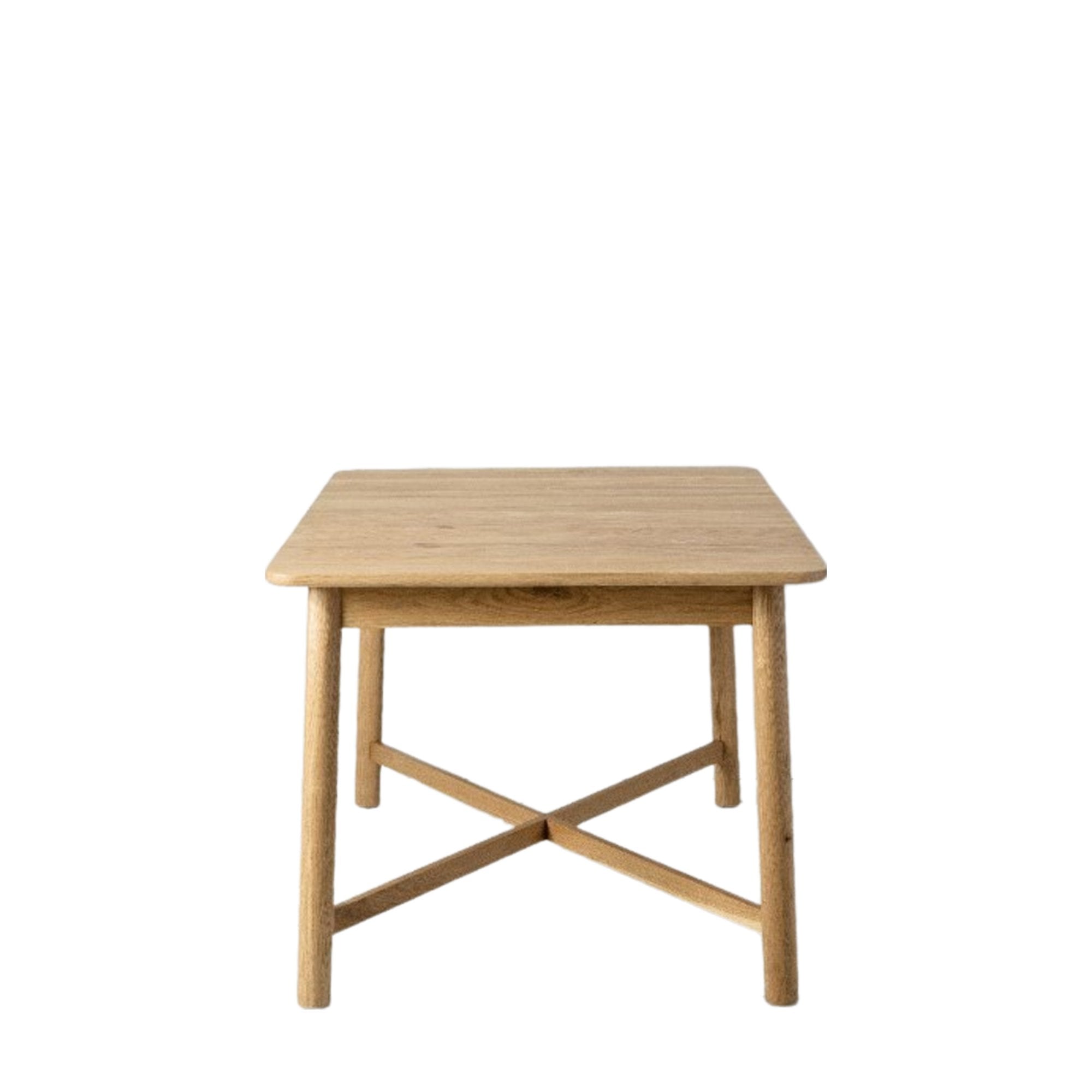 Front view of a square light wood dining table with an X-shaped base.