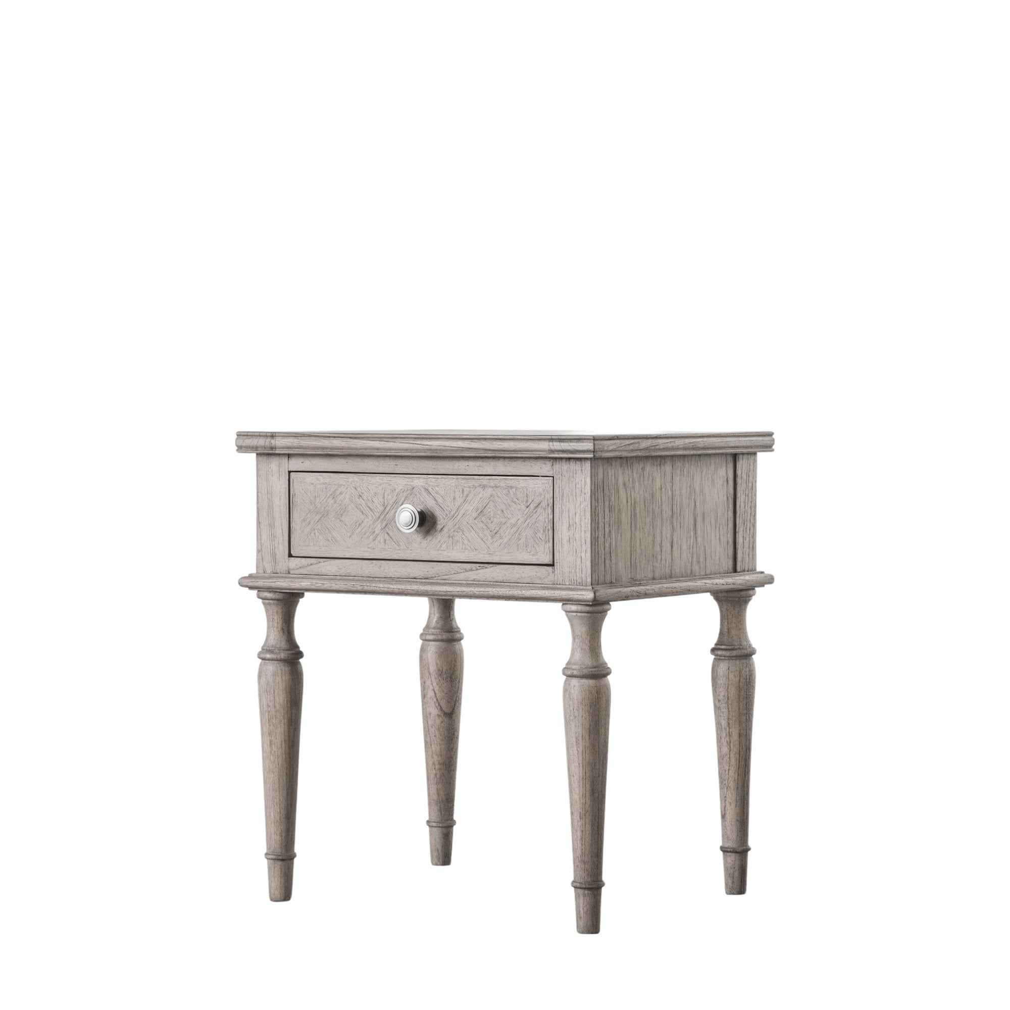 Angled view of a distressed grey bedside table with one drawer and turned legs on white background.