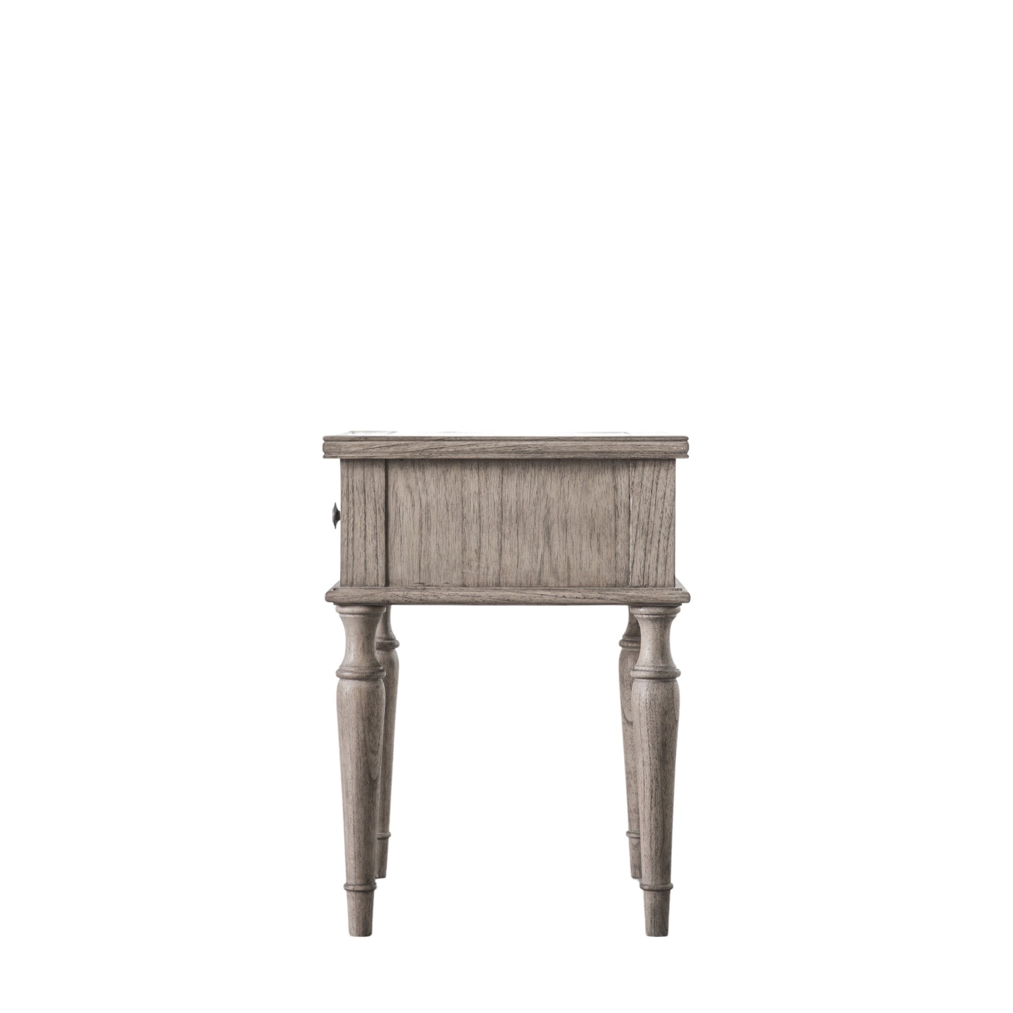 Side view of a distressed grey bedside table with one drawer and turned legs on white background.