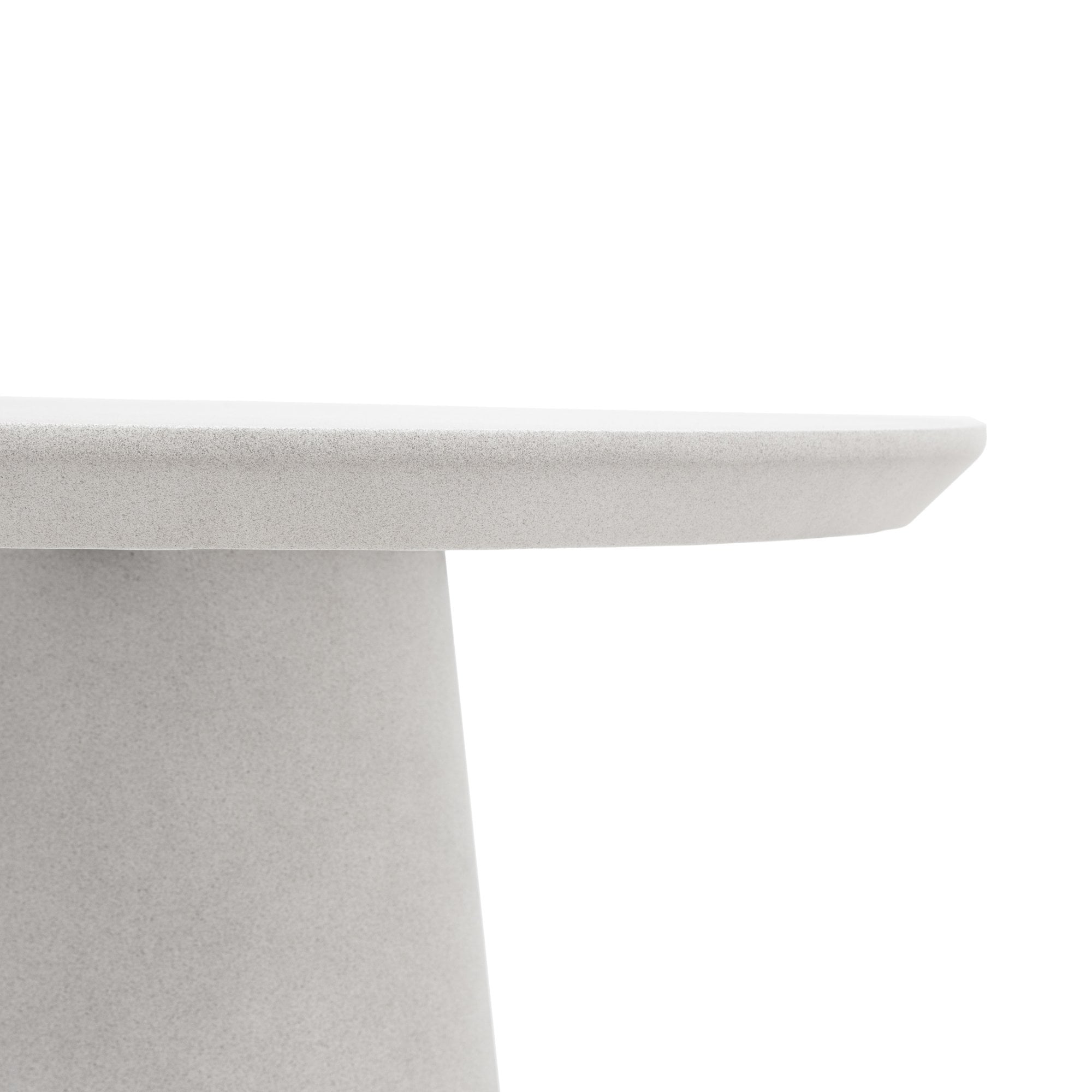 Close-up of the table's edge and the top of its pedestal base, highlighting the texture.