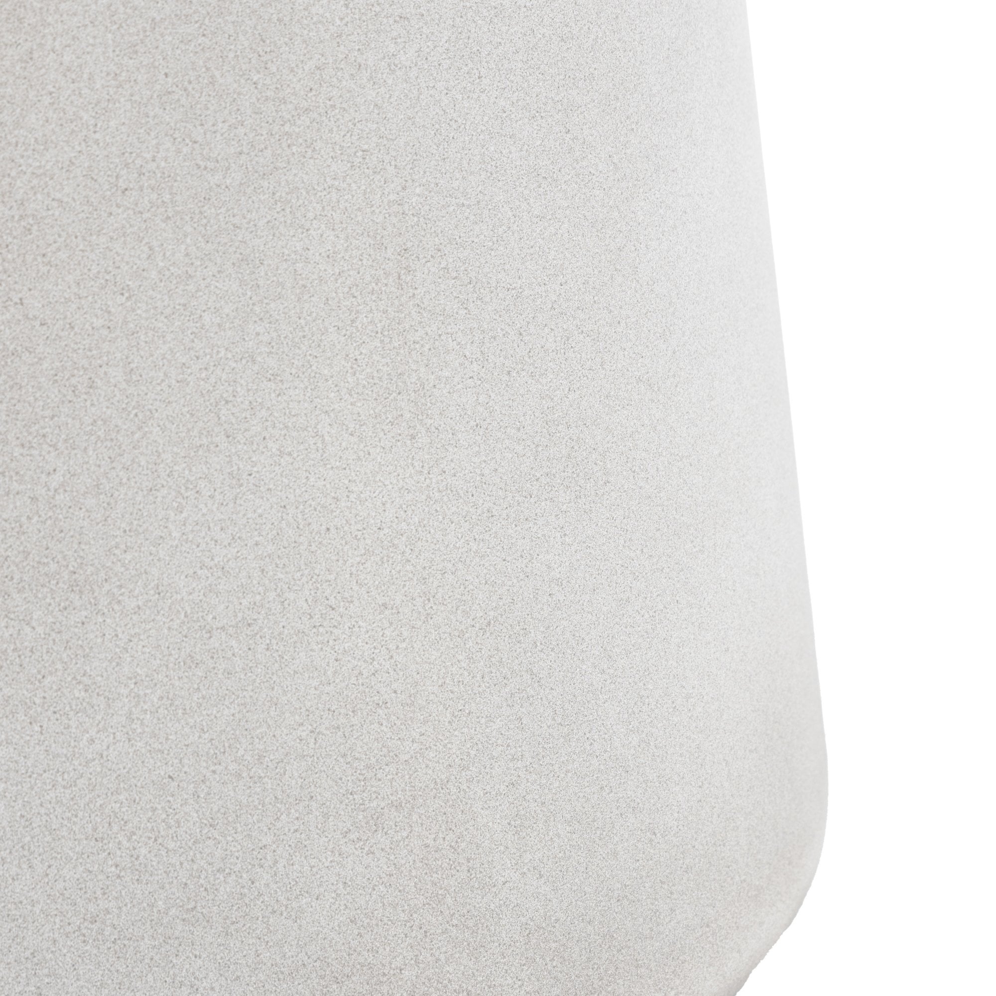 Close-up of the textured surface of the table's pedestal base.