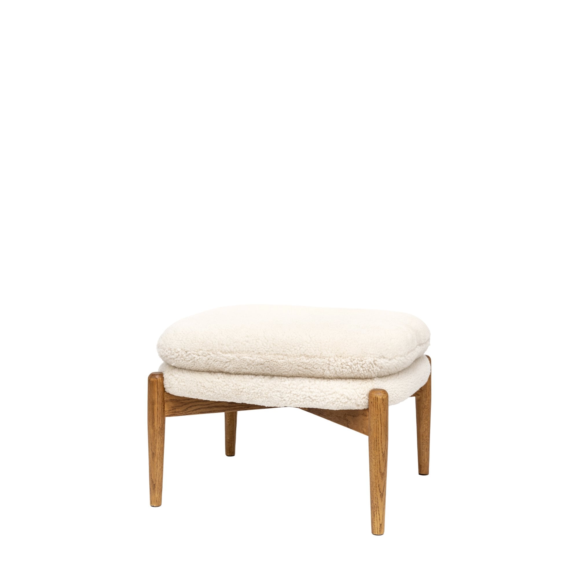 A white sheepskin footstool with a light wooden frame, isolated on a white background.