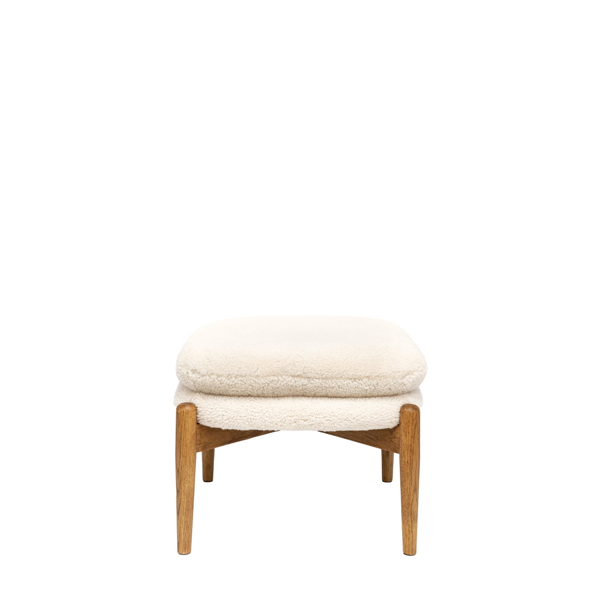 A white sheepskin footstool with a light wooden frame, isolated on a white background.