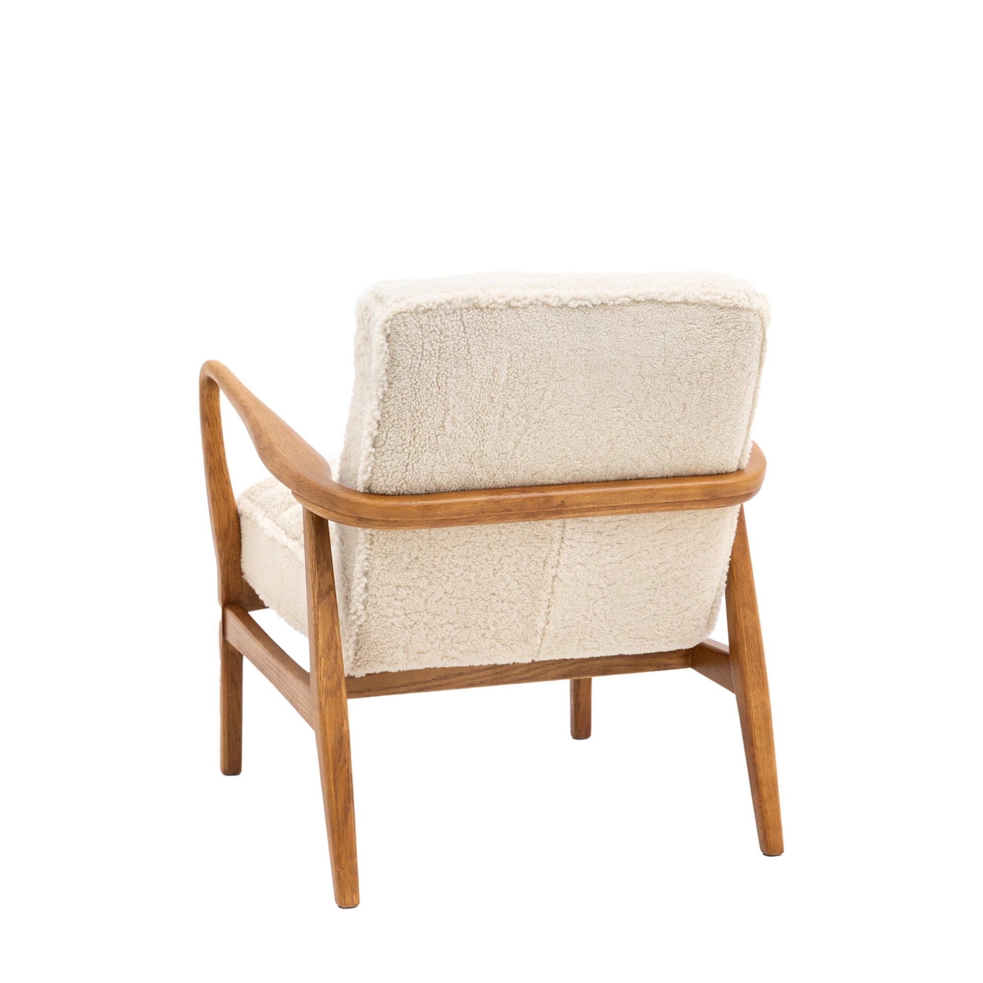 Back view of a cream-colored armchair with a natural wood frame.