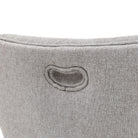 Close-up of the handle cut-out detail on the back of the grey fabric upholstered dining chair.