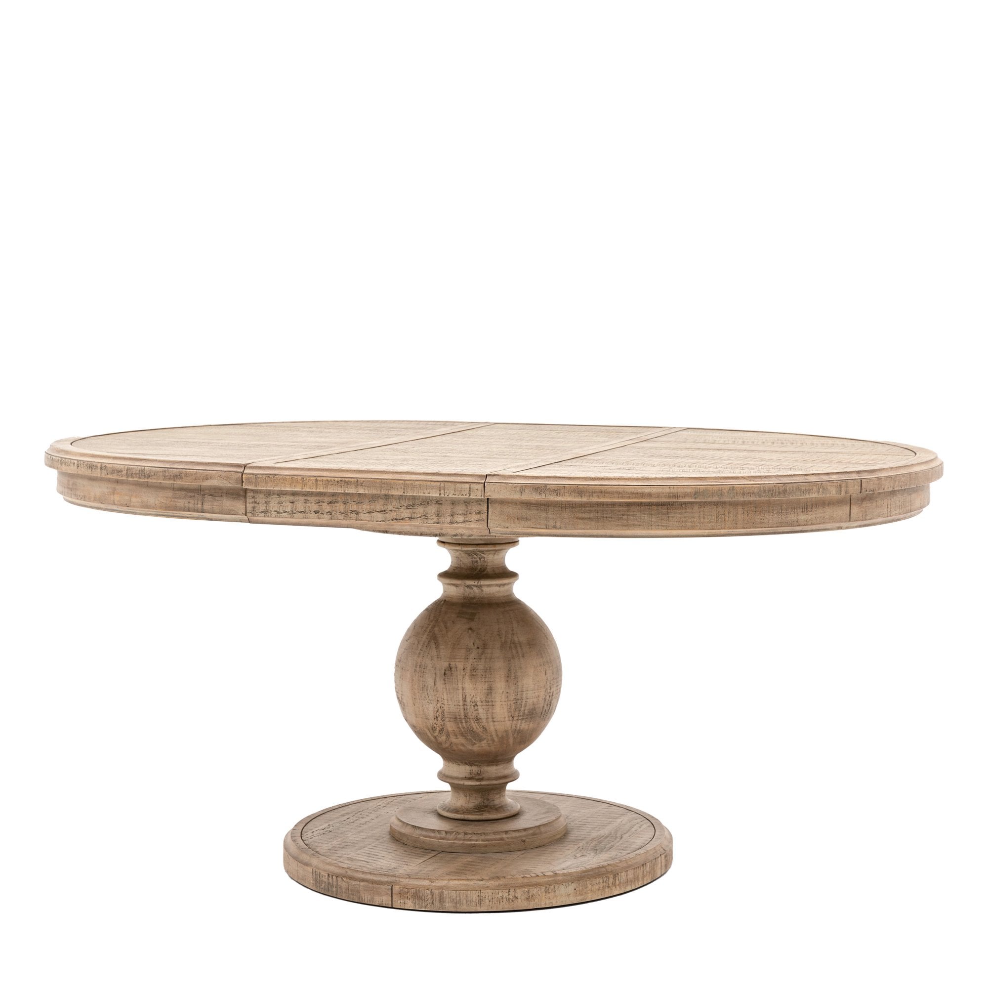 A light wood round dining table with a single pedestal base on a white background.