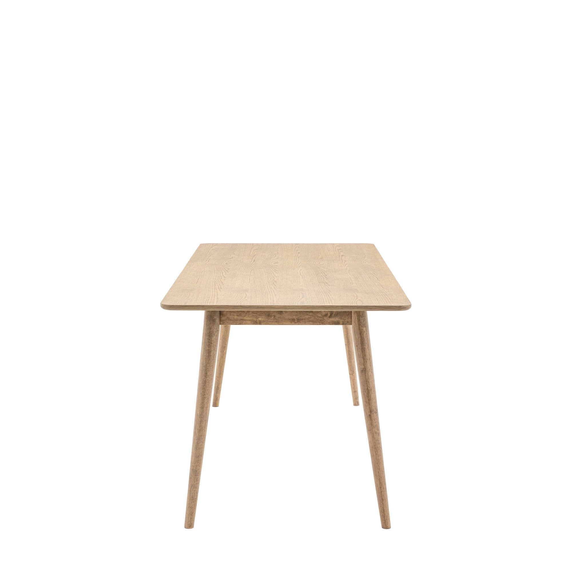 Side view of a light wooden dining table with four tapered legs.