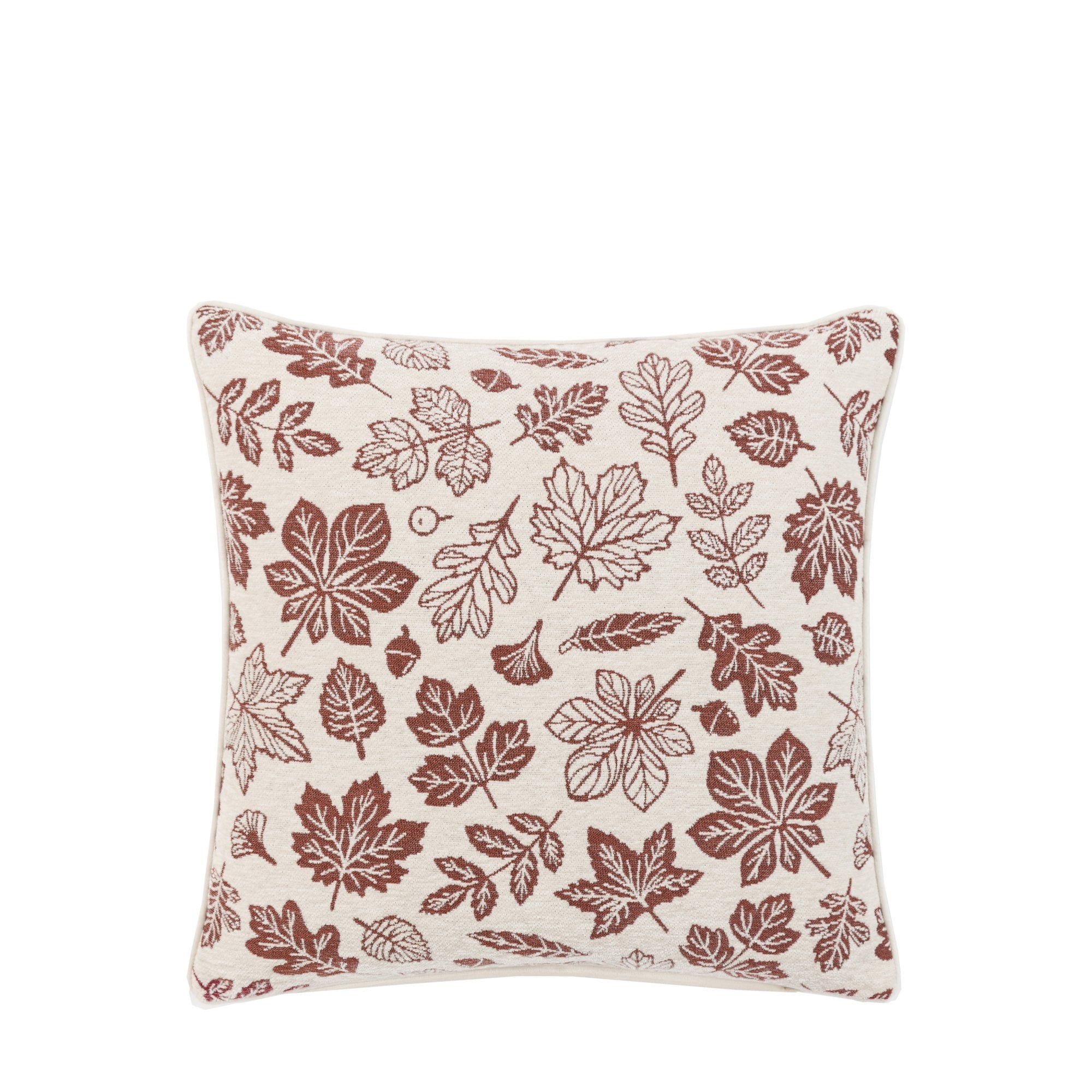 A cream cushion with red autumn leaf patterns on a white background.