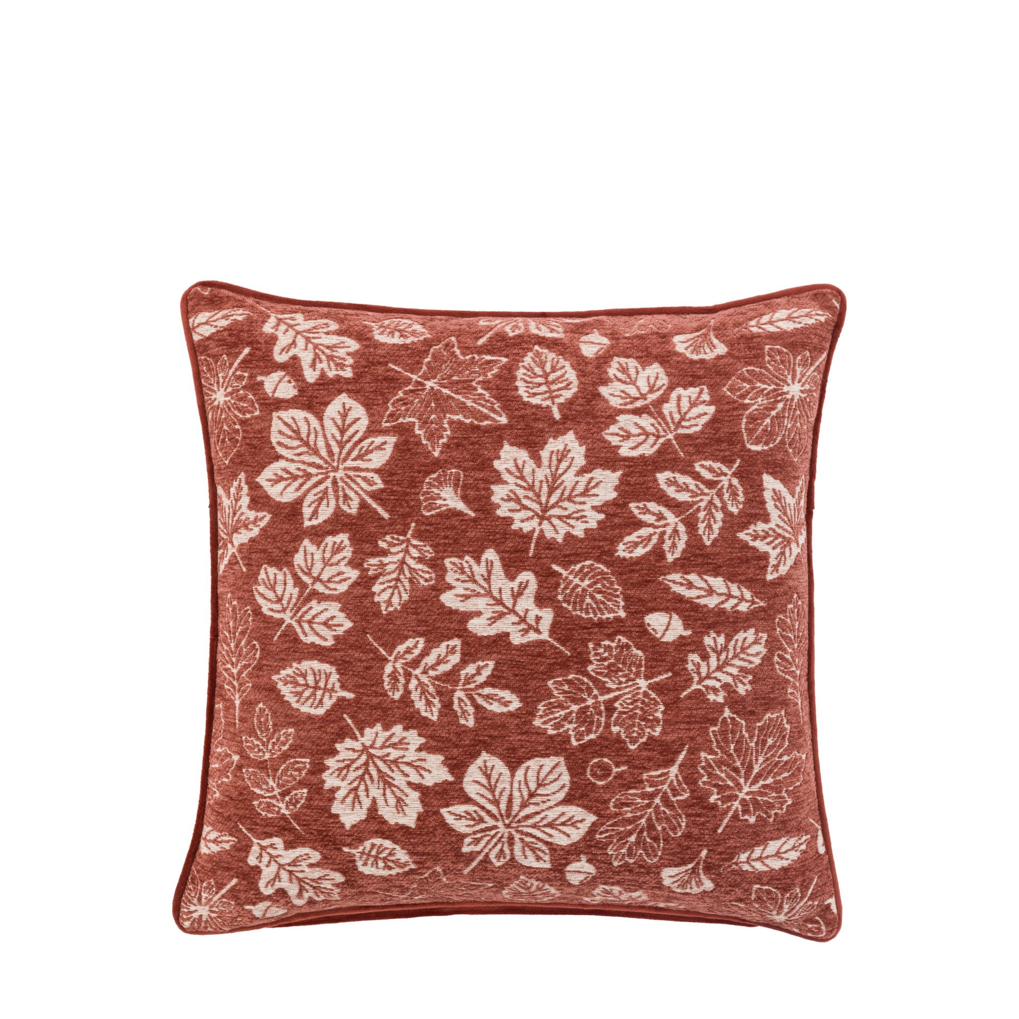 A rust-colored cushion with white leaf patterns on a white background.